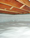 a moisture barrier installed on the walls and floors of a crawl space in Kindersley