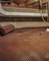 Crawl space drainage matting installed in a home in Reward