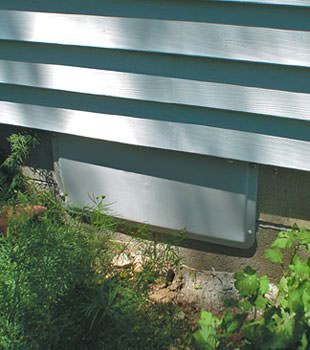 A gray crawl space vent cover in Lockwood