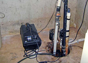 Pedestal sump pump system installed in a home in Grandora