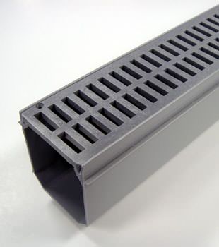 A closeup of our grated basement drainage pipe system, installed in Reward