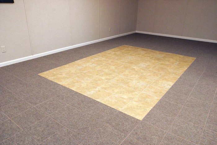 tiled and carpeted basement flooring installed in a Swift Current home