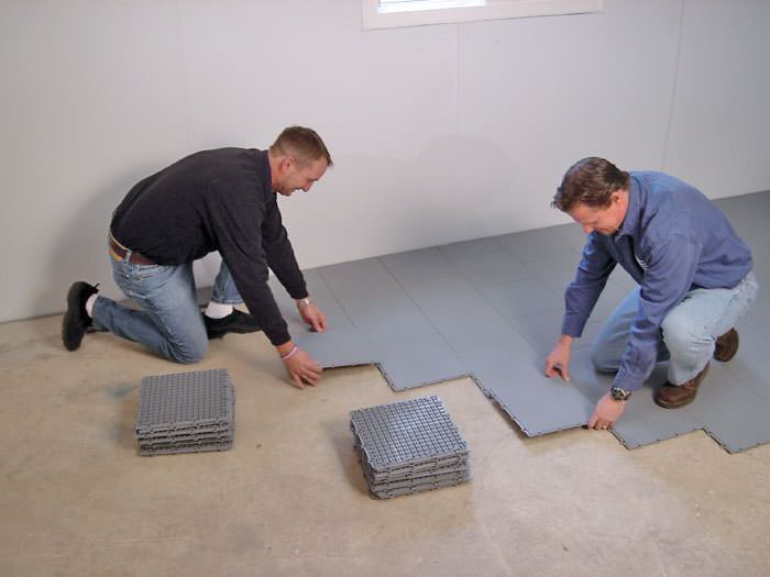 Basement Sub Floor Matting Options In Saskatoon Prince Albert Contractors Installing Basement Suloor Tileatting On A Concrete Floor In Lloydminster Saskatchewan